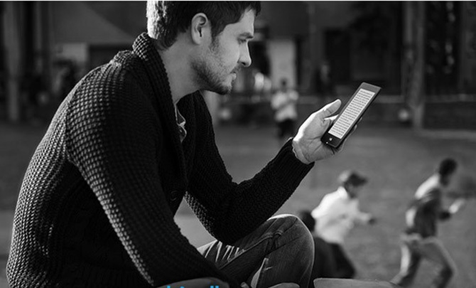 Hipster Man Reading Amazon Kindle